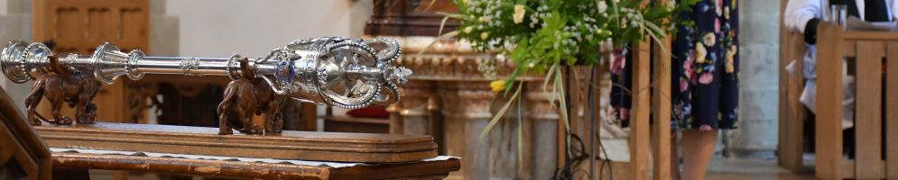 The Civic Mace in the foreground and MP Jane Hunt reading from the lecturn