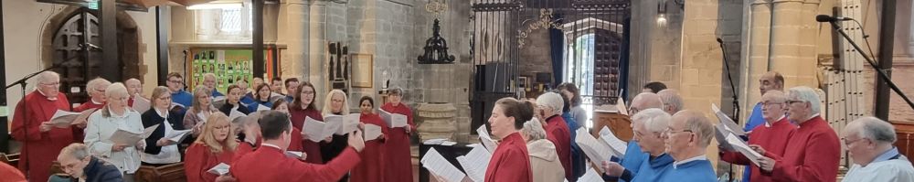 Large group of choristers rehearsing