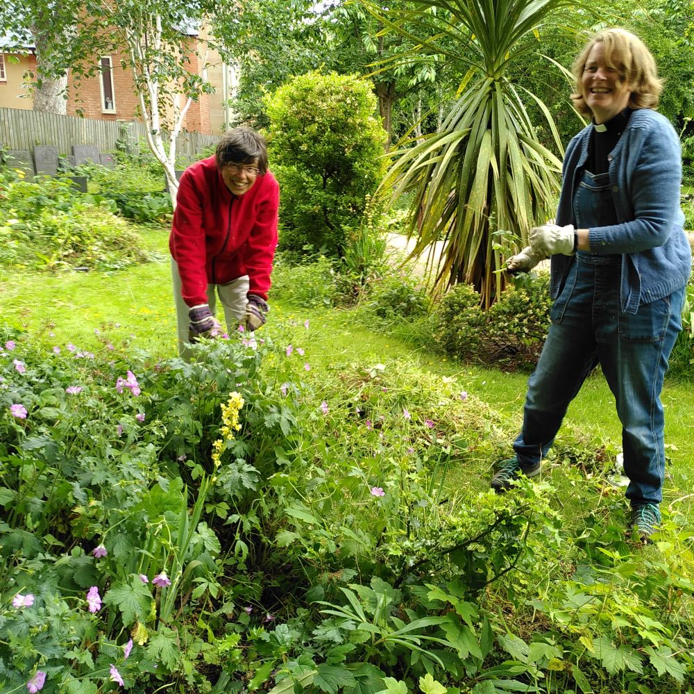 Emily and Bridget wombling on the parish green