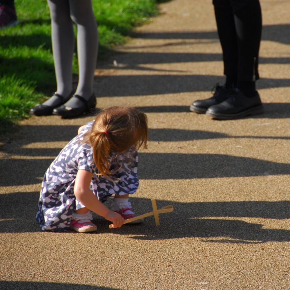 Small child holding Palm Cross