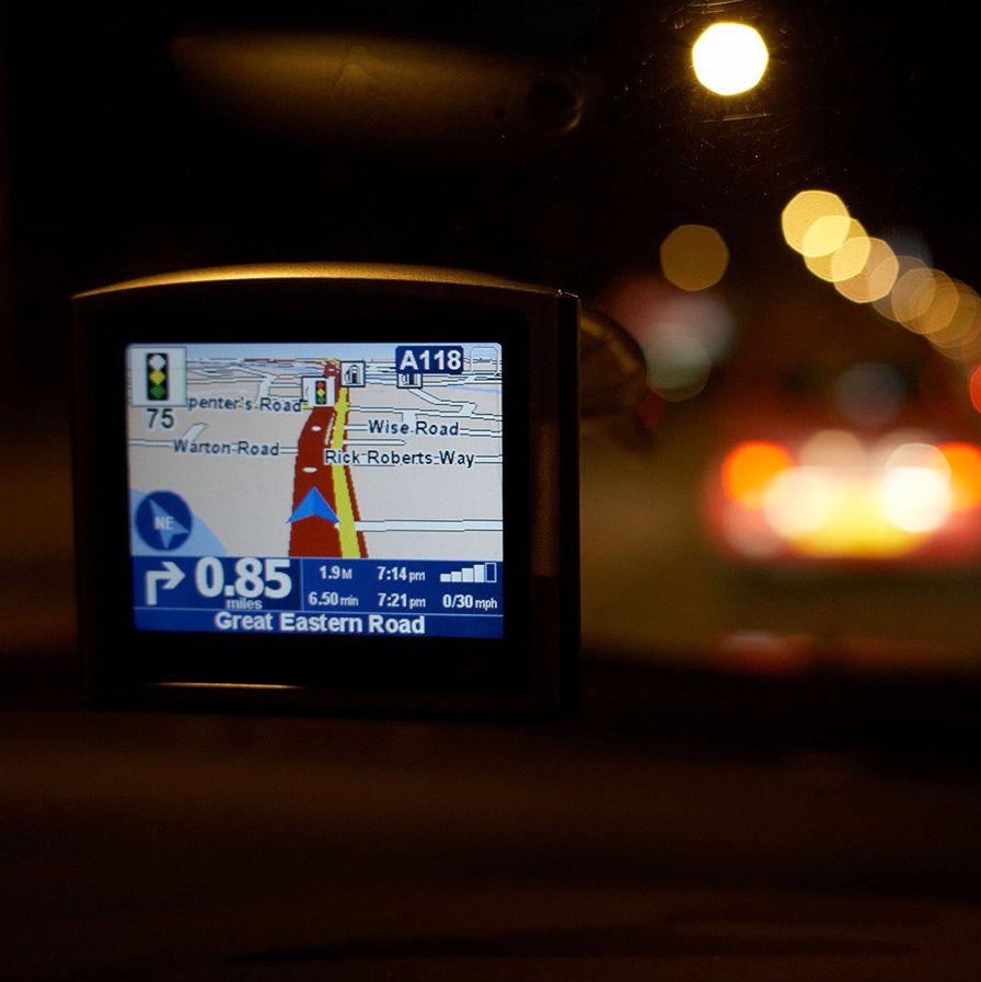 Sat nav system being used in a car at night