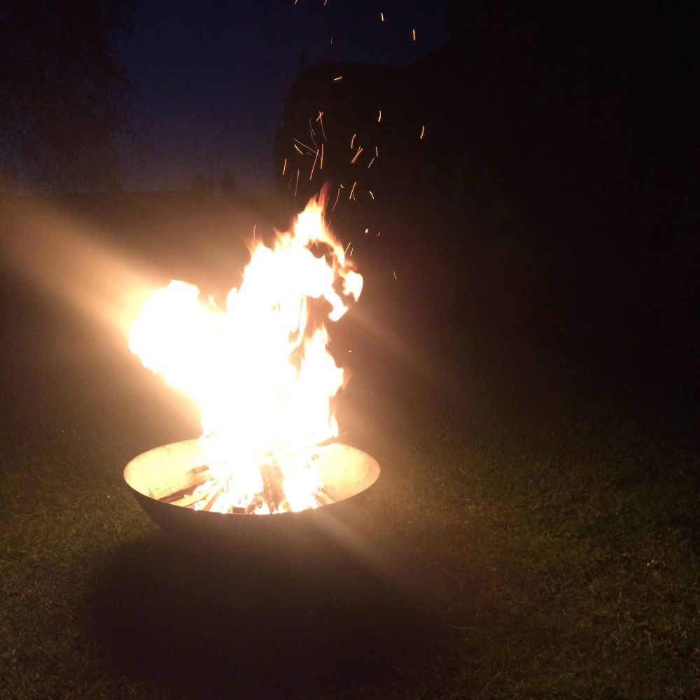 A fire set against a dark night sky