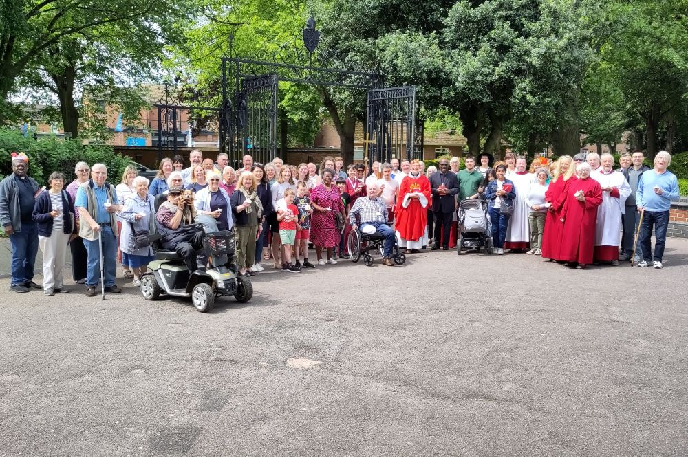 The church congregation gathered outside on Pentecost morning.