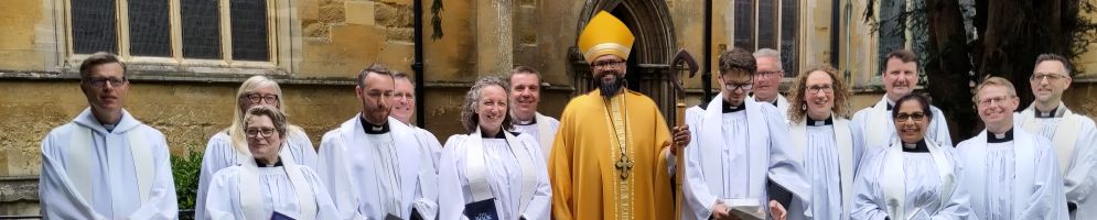 The Bishop of Loughborough surrounded by newly ordained priests