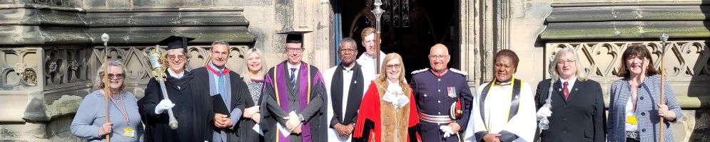 The processional party for the Coronation Service lined up outside the church including the churchwardens, Mayor and Lord-Lieutenant