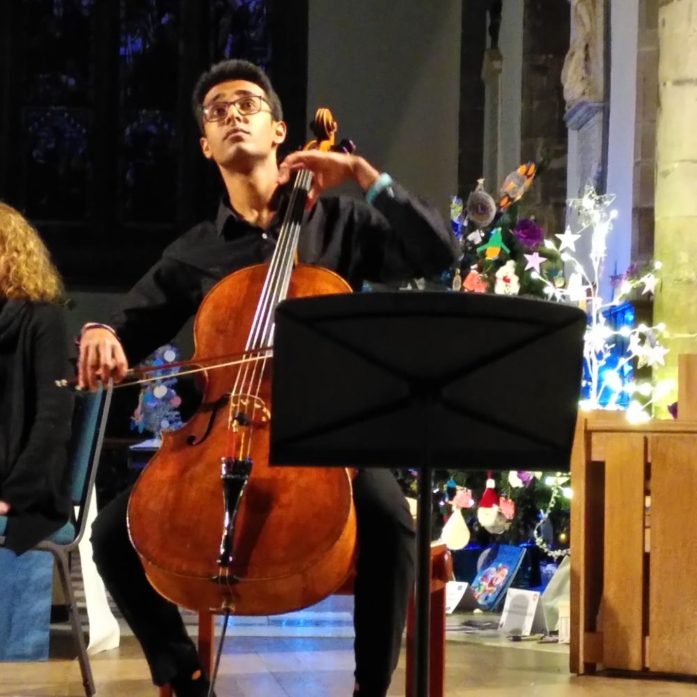 A man playing the cello